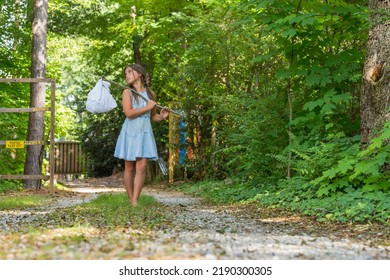 A Homeless, Hungry, Abandoned, Runaway Child Looks For Food And Shelter In An Outdoor Environment