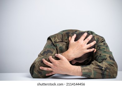 Homeless male soldier addicted to drugs and alcohol sitting alone and depressed feeling anxious and alone at home.