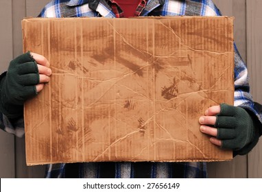 Homeless Man Holding Up Blank Cardboard Sign