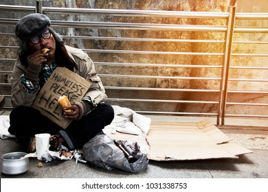 Homeless man on walkway street in the city.