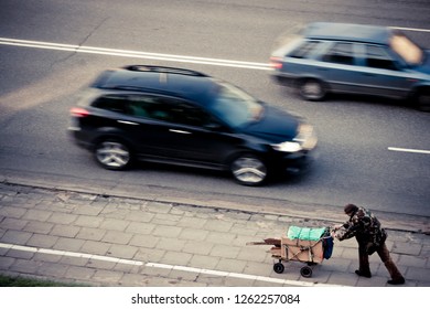 Homeless man on walkway street in the city. - Image