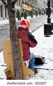 Homeless man playing harmonica in montreal
