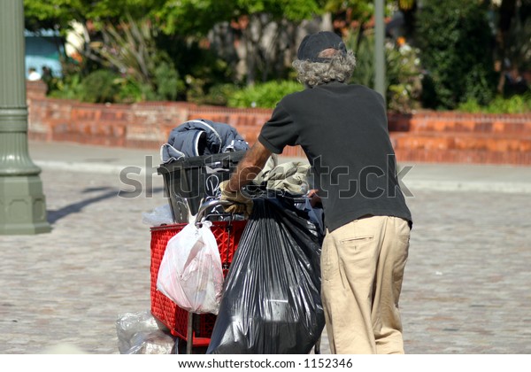 Homeless Man Pushing Cart Stock Photo (Edit Now) 1152346