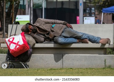 A homeless man rests at the Grand Park in downtown Los Angeles, June 2, 2022. 
