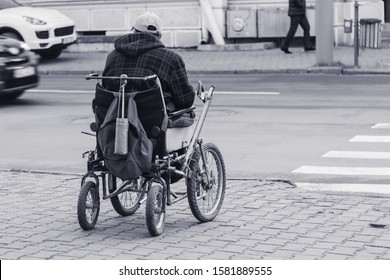 A Homeless Man In A Wheelchair