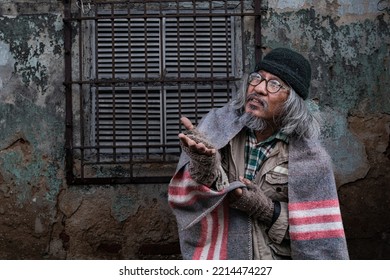 Homeless Old Man Reaching Out To Passerby Ask For Money, Need For Help, Poverty Man No Home Meet Financial Crisis Ask For Food Live On Sidewalk. Donate And Charity Concept.