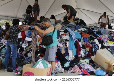 Homeless People Collect Clothes From Volunteers Donations. Victims Of Natural Disaster Landslide At Petropolis City, Lost All Belongings At Morro Da Oficina. Rio De Janeiro, Brazil 02.25.2022