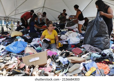 Homeless People Collect Clothes From Volunteers Donations. Victims Of Natural Disaster Landslide At Petropolis City, Lost All Belongins At Morro Da Oficina. Rio De Janeiro, Brazil 02.25.2022