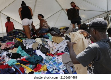 Homeless People Collect Clothes From Volunteers Donations. Victims Of Natural Disaster Landslide At Petropolis City, Lost All Belongins At Morro Da Oficina. Rio De Janeiro, Brazil 02.25.2022