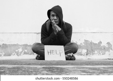 Homeless person with help sign,Poverty issue