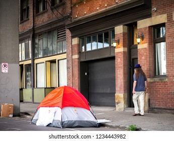 Homeless person tent in the Seattle city, Washington. Homeless man sleep at outdoors shelter.