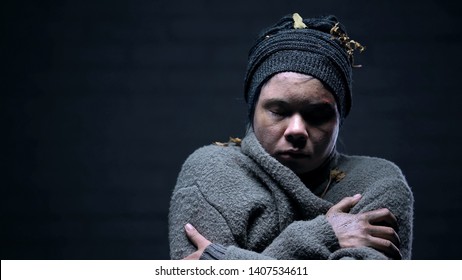 Homeless Woman Closed Eyes Suffering Cold On Dark Background, Depressed Beggar