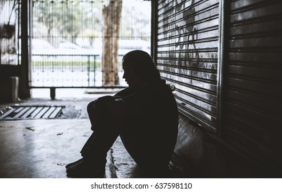 Homeless Woman Sitting on The Street Side Hopeless - Shutterstock ID 637598110