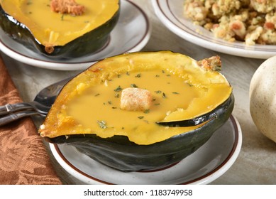 Homemade Acorn Or Butternut Squash Soup Served In An Acorn Squash Shell.