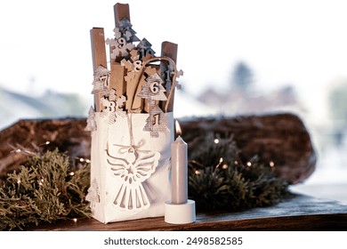 Homemade advent calendar made of cardboard. Small cardboard boxes in a paper bag decorated on rustic wood. Sustainable christmas packaging. Background for a eco friendly christmas surprise. - Powered by Shutterstock