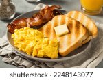 Homemade American Scrambled Egg Breakfast with Bacon and Toast