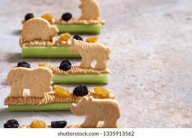 Homemade Ants On A Log Snack With Celery Peanut Butter, Raisins And Cookie