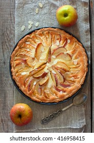 Homemade Apple Cake With Almond And Cinnamon Over Natural Wood Background, Top View