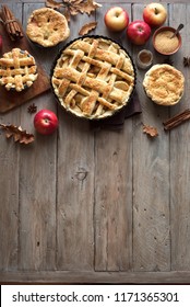 Homemade Apple Pies On Rustic Background, Top View, Copy Space. Classic Autumn Thanksgiving Dessert - Organic Apple Pie.