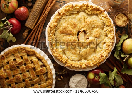 Homemade apple pies on a rustic background