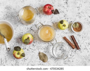 Homemade Apple Sauce In Glass Jars On Light Background. Top View