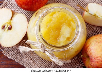 Homemade Apple Sauce Or Apple Puree In Glass Bowl Over Rustic Wooden Table. Top View