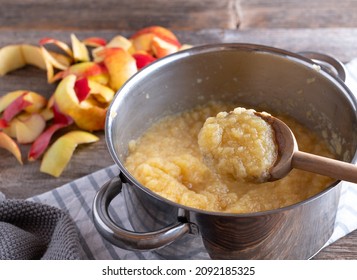 Homemade Applesauce In A Pot With Wooden Spoon