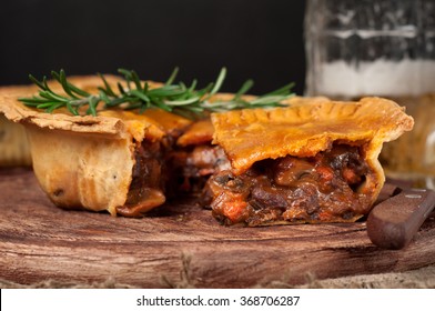 Homemade Australian Meat Pie On The Wooden Table Closeup With Copy Space, Rustic Style