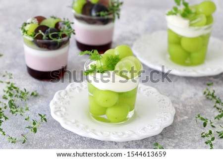 Homemade autumn glass desserts with grapes
