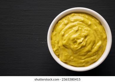 Homemade Avocado Guacamole in a Bowl, top view. Copy space. - Shutterstock ID 2365380415