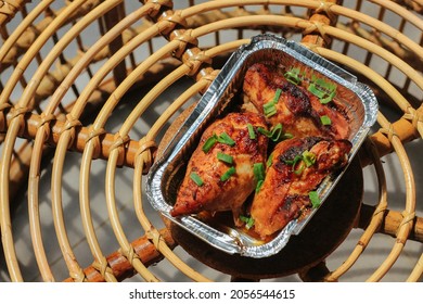 Homemade Baked Chicken Breast In The Aluminum Foil Box Serve In Table.  Barbecue Grill. Selective Focus. 