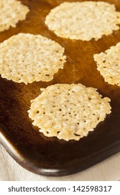 Homemade Baked Parmesan Cheese Crisp Against A Background