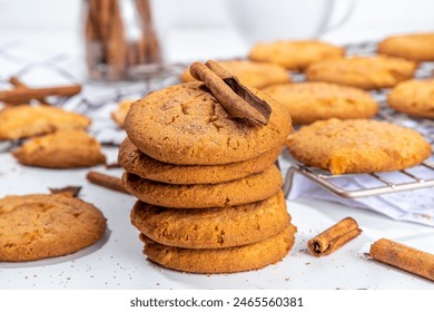 Homemade baked winter cinnamon cookies, Snickerdoodle bisquit scones on white kitchen background - Powered by Shutterstock