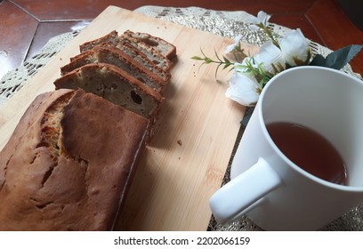 Homemade Banana Cake With A Mug Of Hot Tea