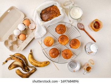 Homemade Banana And Honey Muffins, Banana Bread, Various Ingredients On Kitchen Tabletop. Flat Layout, Horizontal Image