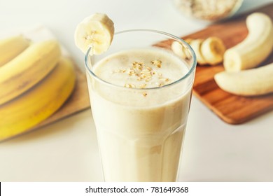 Homemade Banana Smoothie With Oat Flakes On White Background. Close Up. Selective Focus.