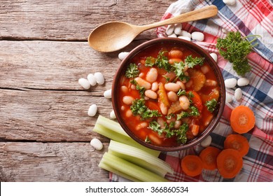 Homemade bean soup with ingredients. horizontal view from above