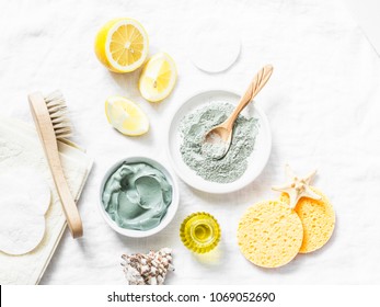 Homemade Beauty Facial Mask. Clay, Lemon, Oil, Facial Brush - Beauty Products Ingredients On Light Background, Top View