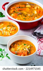 Homemade Beef Meat Soup With Carrot, Potato, Corn And Sweet Potato In White Bowl. Winter Comfort Food Concept.