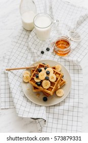 Homemade Belgian Waffles With Milk And Honey On Table. Delicious Breakfast