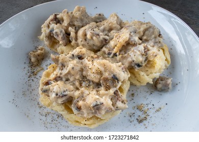 Homemade Biscuits And Sausage Gravy On Plate