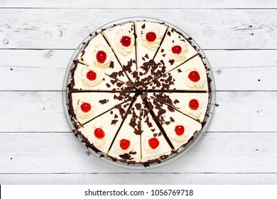 Homemade black forest cake decorated with whipped cream, dark chocolate and cherries. Top view. Copy space.
 - Powered by Shutterstock