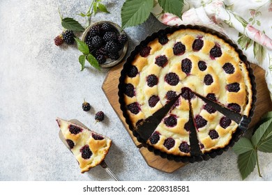 Homemade blackberry pie. Vegan gluten-free pastry. Sweet pie with blackberry and custard on stone tabletop. View from above. Copy space. - Powered by Shutterstock