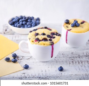 Homemade Blueberry Muffins Mug Cake With Fresh Berries On Rustic Wooden Background