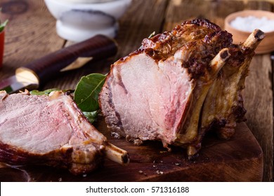 Homemade Bone-in Prime Rib Roast On Rustic Wooden Table