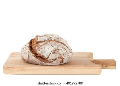 Homemade bread on wooden cutting board isolated on white background