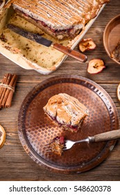 Homemade bread pudding on a rustic table