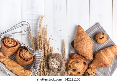 Homemade breads or bun on wood background, croissant puff cinnamon, breakfast food