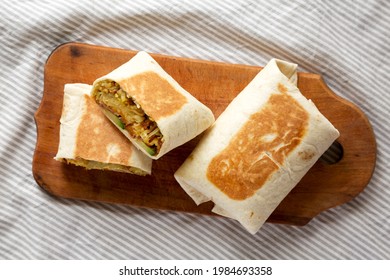 Homemade Breakfast Egg Burrito With Avocado And Bacon On A Rustic Wooden Board, Top View. Flat Lay, Overhead, From Above.