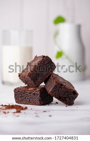 Homemade brownie cakes on a white background look appetizing.
